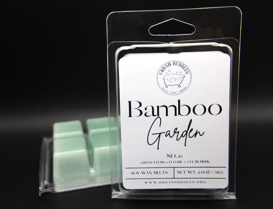 Packaged wax melts labeled 'Bamboo Garden' with a visible brand logo on a dark background.