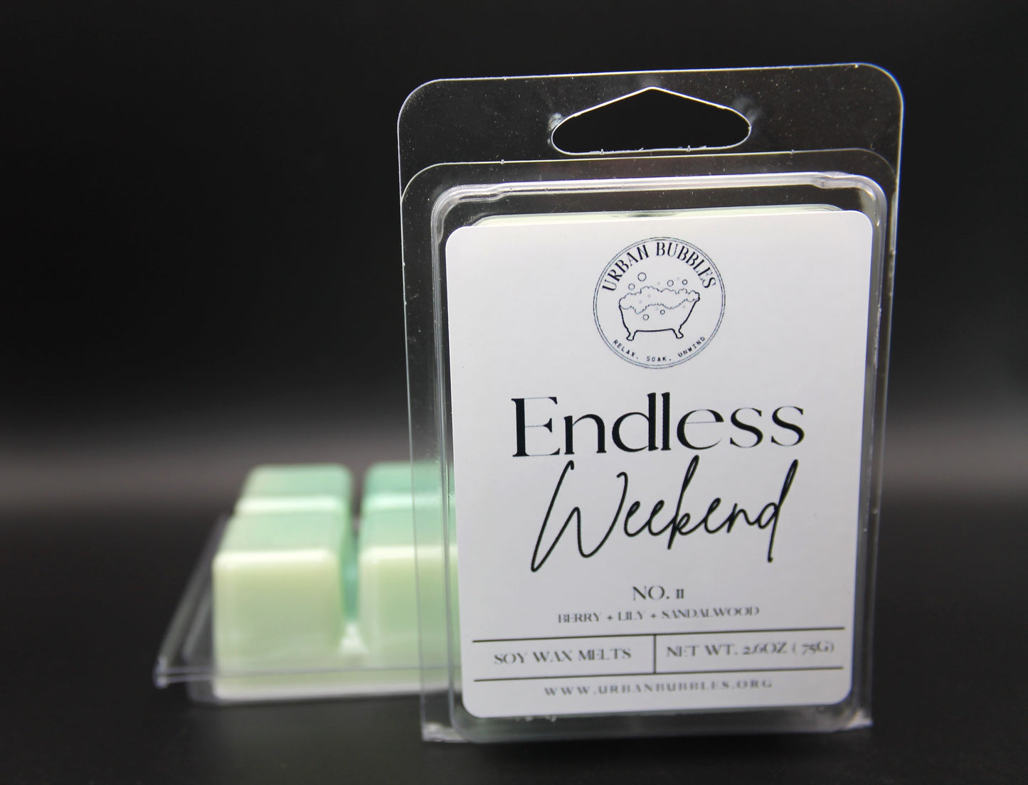Wax melts in packaging with 'Endless Weekend' label on a dark background