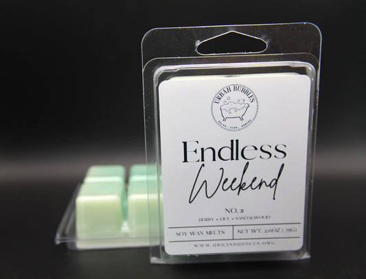 Wax melts in packaging with 'Endless Weekend' label on a dark background