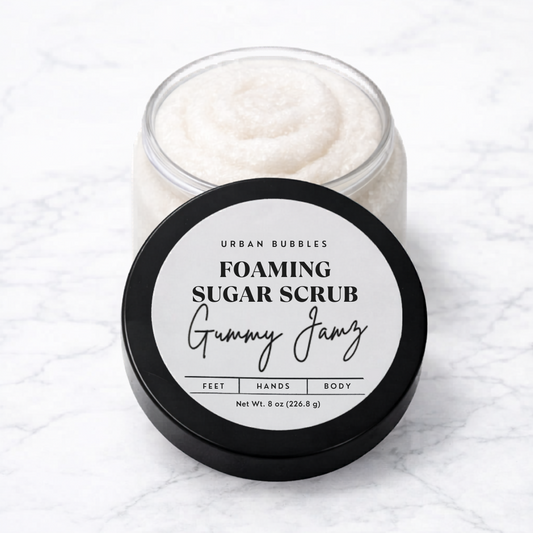 Foaming sugar scrub in a jar with a white label on a white background