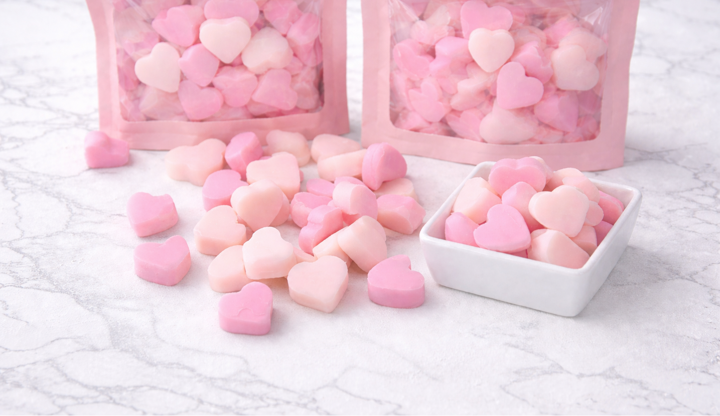 Heart shaped mini wax melts on marble surface