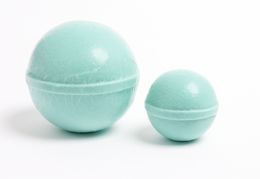 Two turquoise bath bombs on a white background