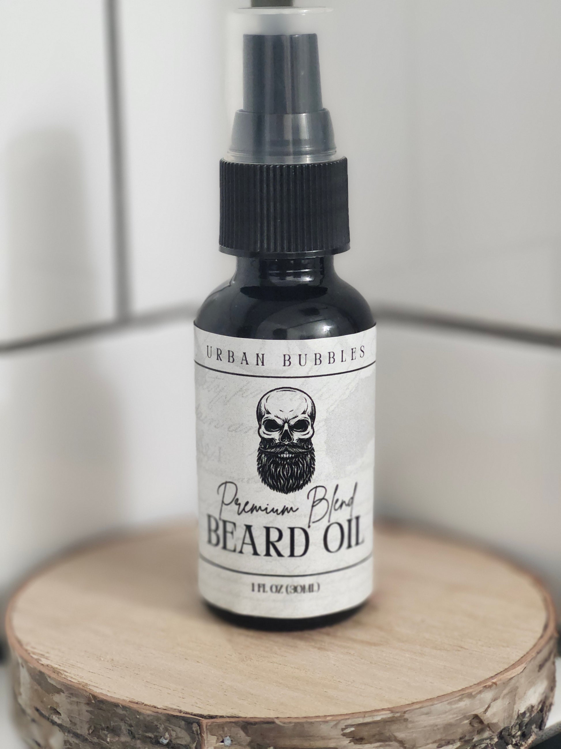 Beard oil bottle with skull design label on a wooden block