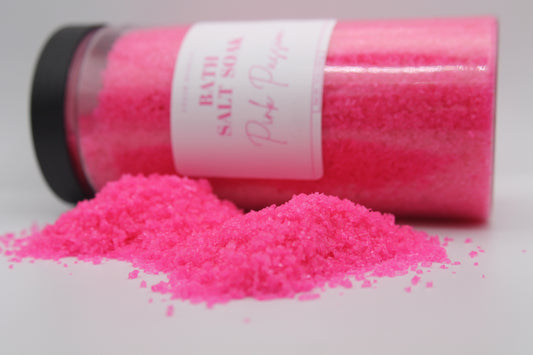 Pink bath salt with a visible label on a white background